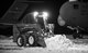 A maintainer from the 736th Aircraft Maintenance Squadron uses a Bobcat to clear snow around a C-17A Globemaster III, Jan. 5, 2018, at Dover Air Force Base, Del. The 436th Operations Support Squadron weather flight recorded eight inches of snow fell on the base from Winter Storm Grayson. (U.S. Air Force photo by Roland Balik)