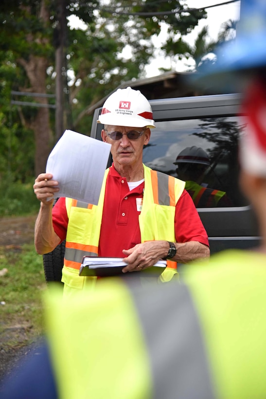 U.S. Army Corps of Engineers Task Force Power Restoration Safety Manager Bill Pioli, of Buffalo District, Buffalo, New York, goes over a Traffic Control Zone checklist while observing a MasTec crew at work in Naranjito, Puerto Rico, Jan. 6. Pioli and the task force safety team conducted an island-wide Traffic Control Zone Intervention to reduce the risk of traffic mishaps for electrical grid restoration teams working to restore power in Puerto Rico.