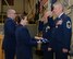 Brig. Gen. Paul N. Hutchinson (center) and Chief Master Sgt. Matthew J. Collier (foreground) are presented American flags during their retirement, at Pease Air National Guard Base, N.H., Jan. 6, 2017. Both men were most recently assigned to headquarters, New Hampshire ANG. (N.H. Air National Guard photo by Staff Sgt. Curtis J. Lenz)
