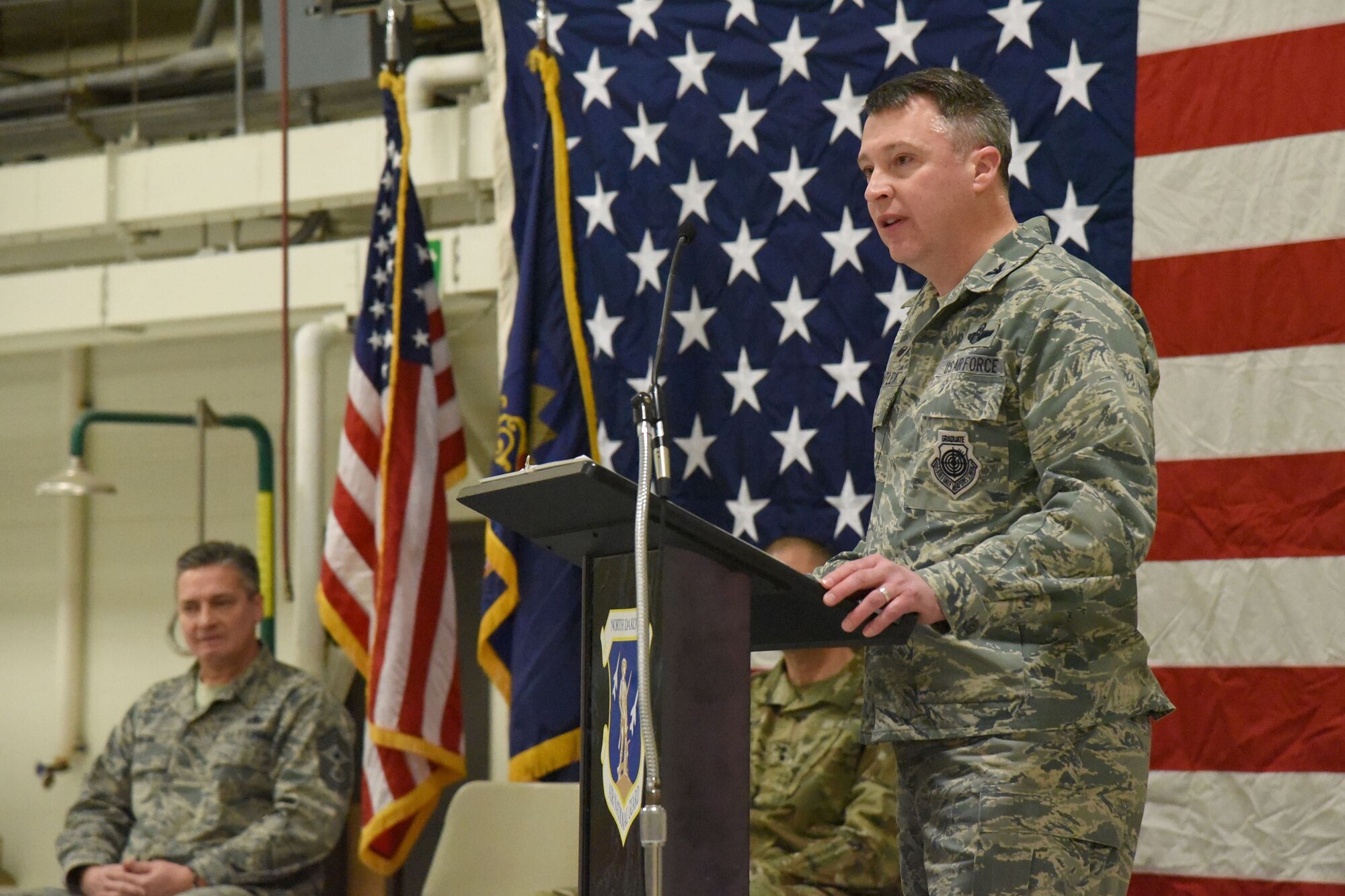 Col. Britt Hatley, the 119th Wing commander, speaks to a 119th Wing unit member formation and a gathering of civilian dignitaries gathered for a ceremony formally recognizing the unit with the Air Force Outstanding Unit Award at the North Dakota Air National Guard Base, Fargo, N.D., Jan. 6, 2017.