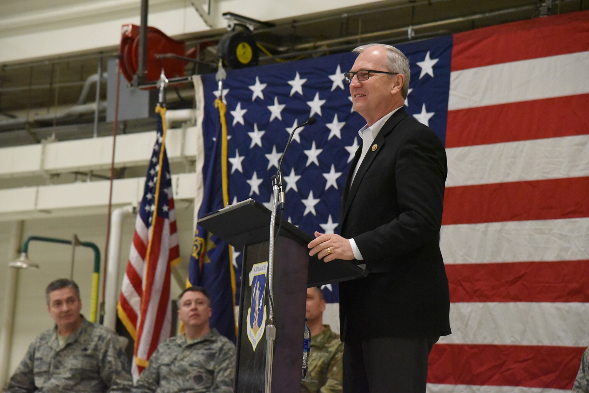 United States Congressman Kevin Cramer, North Dakota, speaks to a 119th Wing unit member formation and a gathering of civilian dignitaries gathered for a ceremony formally recognizing the unit with the Air Force Outstanding Unit Award at the North Dakota Air National Guard Base, Fargo, N.D., Jan. 6, 2017.