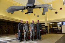 Gen. Mike Holmes, commander of Air Combat Command, Brig. Gen. Andrew Toth, ACC Director of Operations, Col. Paul Murray, 99th Air Base Wing commander and Col. Julian Cheater, 432nd Wing/432nd Air Expeditionary Wing commander pose for a group photo during a visit to Creech Air Force Base, Nev., Jan. 6, 2018. Holmes visited the Airmen of the 432nd Wing/432nd Air Expeditionary Wing to view Remotely Piloted Aircraft operations firsthand and to the discuss future of the enterprise. (U.S. Air Force photo/Senior Airman Christian Clausen)