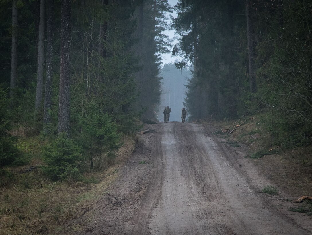 Soldiers assigned to 3rd Squadron, 2nd Cavalry Regiment, carry a weighted litter on the second day of the unit’s three-day sniper school tryouts in Bemowo Piskie, Poland, Jan. 3, 2018. Army photo by Spc. Andrew McNeil