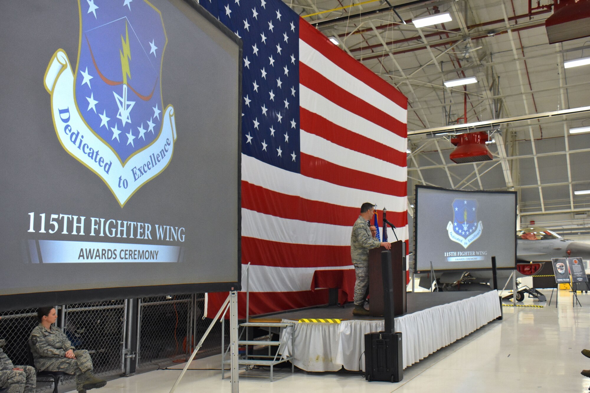 Col. Erik Peterson, commander of the Wisconsin Air National Guard's 115th Fighter Wing addresses unit members during the annual awards ceremony at Truax Field in Madison, Wisconsin, Jan. 6, 2017. The ceremony highlighted Airman from throughout the unit who displayed exemplary skill and leadership in the performance of their duties both at home, and in deployed locations around the world. (U.S. Air National Guard photo by Master Sgt. Paul Gorman)