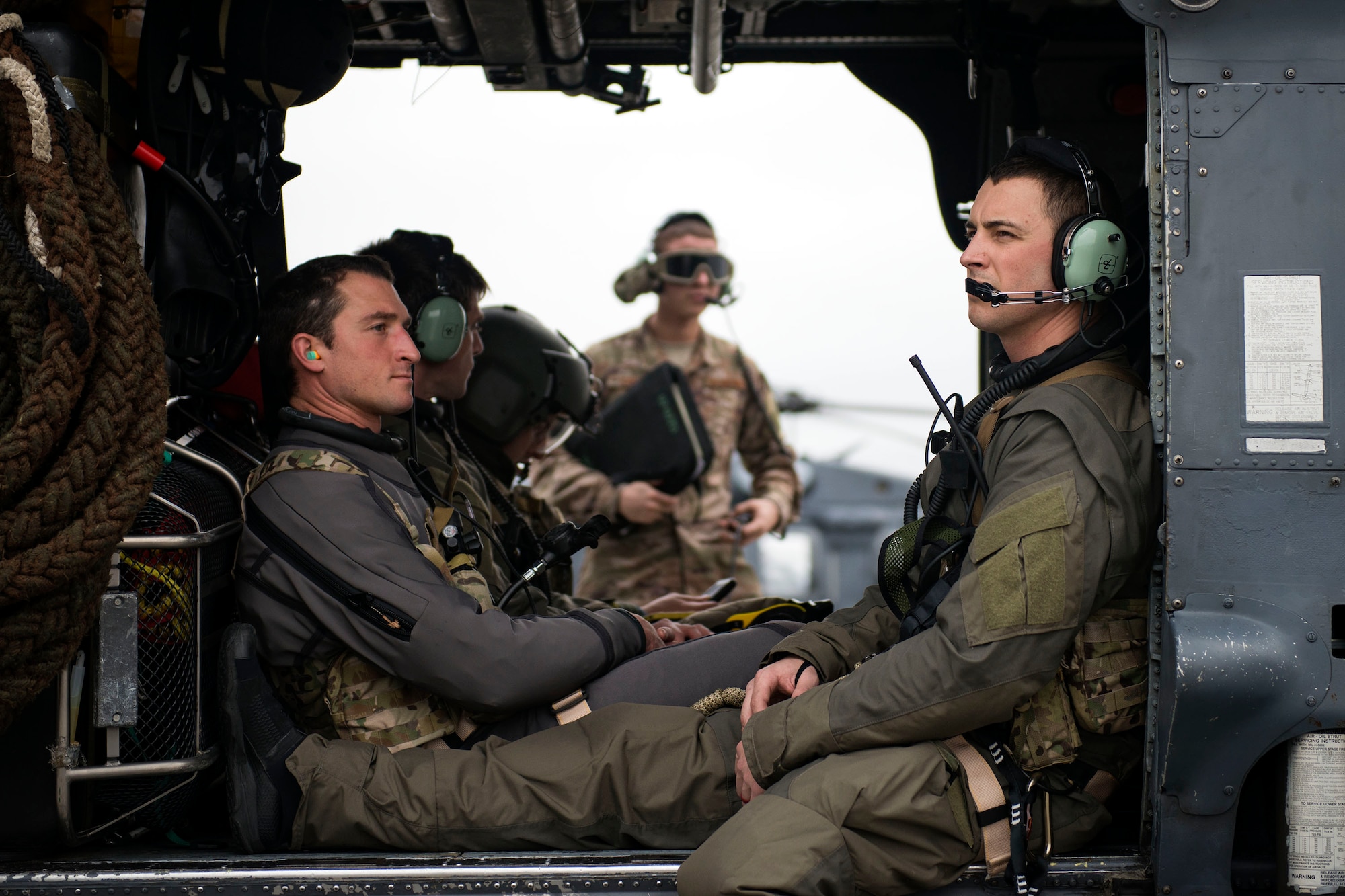 Pararescuemen await takeoff for a training mission in an HH-60G Pave Hawk, Jan. 9, 2018, at Moody Air Force, Ga. The 41st Helicopter Maintenance Unit keeps Pave Hawks operationally ready by performing inspections and repairs on various components of the helicopter. Those efforts are critical in facilitating the mission of the 41st Rescue Squadron at Moody. (U.S. Air Force photo by Airman 1st Class Erick Requadt)