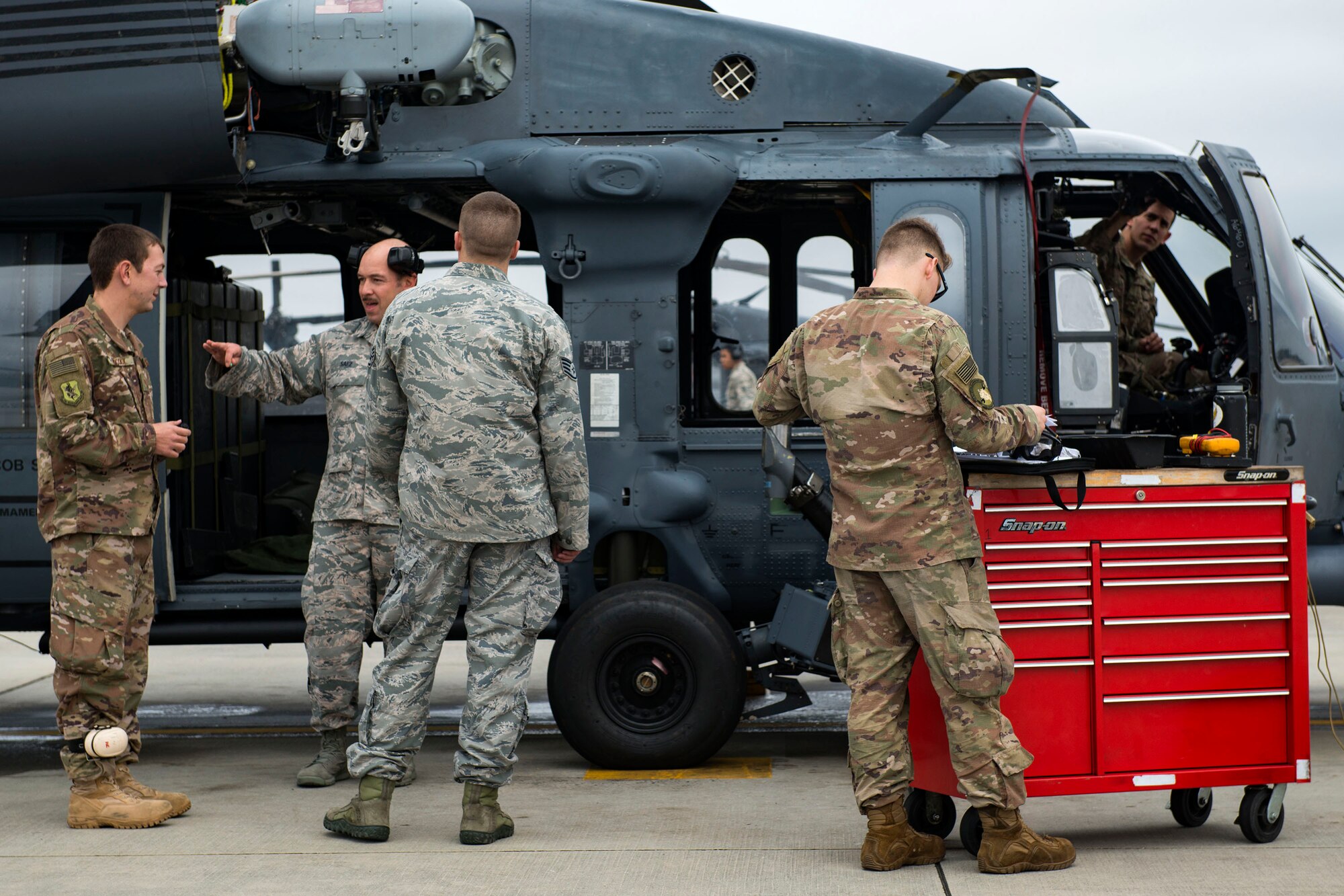 Airmen assigned to the 41st Helicopter Maintenance Unit (HMU) perform maintenance on an HH-60G Pave Hawk, Jan. 9, 2018, at Moody Air Force Base, Ga. The 41st HMU keeps Pave Hawks operationally ready by performing inspections and repairs on various components of the helicopter. Those efforts are critical in facilitating the mission of the 41st Rescue Squadron at Moody. (U.S. Air Force photo by Airman 1st Class Erick Requadt)