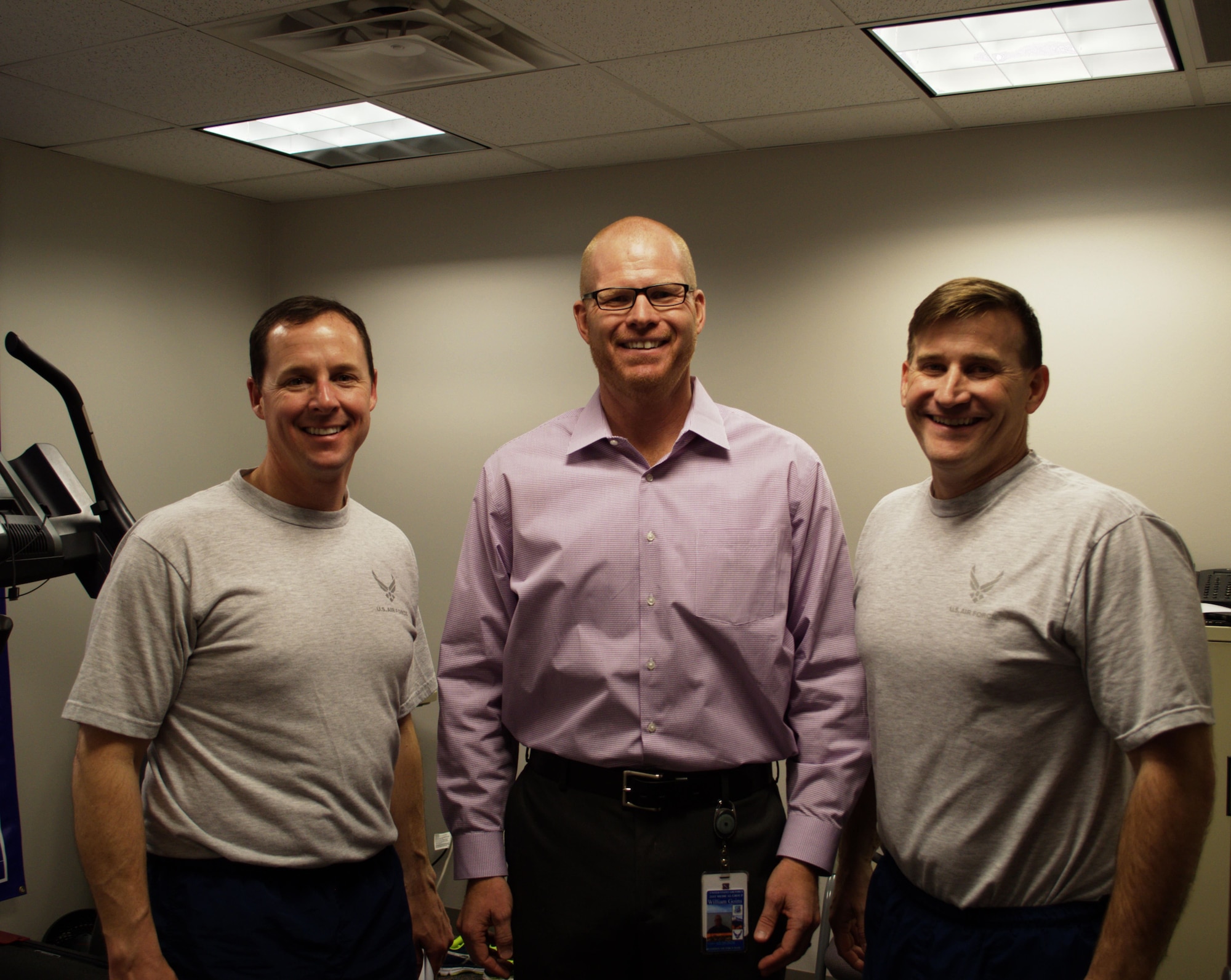PETERSON AIR FORCE BASE, Colo. – Col. Todd Moore, 21st Space Wing commander, Bill Goins, 21st Force Support Squadron Fitness Center, exercise physiologist, and Chief Master Sgt. Mark Bronson, 21st Space Wing command chief, said more Airmen should take advantage of services offered at the Fitness Center. The Bod Pod Body Fat Assessment, the VO2 max Fitness Assessment and the Biomechanical Gait Analysis all help measure fitness levels and are a few of the services available at the Health Promotion Office to Department of Defense ID card holders or Tricare beneficiaries. (U.S. Air Force photo by Audrey Jensen)