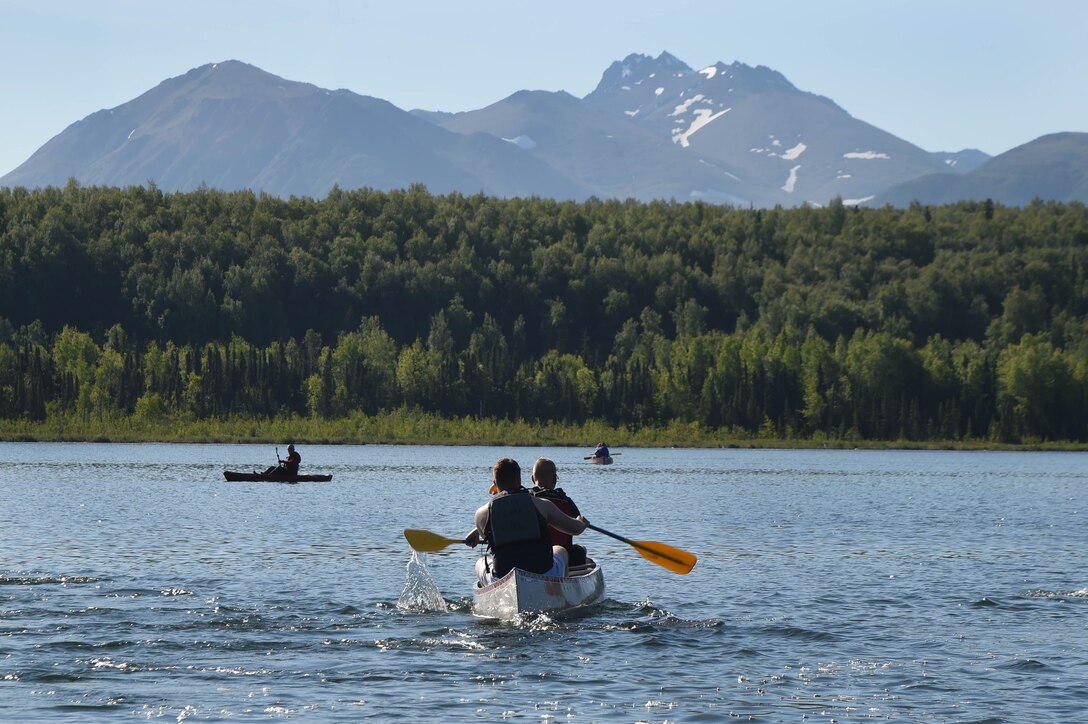 Community members use canoes at Otter Lake, Joint Base Elmendorf-Richardson, Alaska June, 17 2016. Programs such as iSportsman provide the public with tools necessary for undeveloped areas on base to be used for recreation opportunities, while also keeping both the public and military operations safe and thriving.