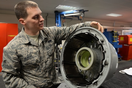 Airman 1st Class Clark Albers, C-17 Globemaster III crew chief and aerospace maintenance journeyman, inspects a C-17 wheel in the Wheel and Tire Shop at Joint Base Elmendorf-Richardson, Alaska December 18, 2017. Albers is checking for heat damage, missing paint, gouging, and dents in the wheel.