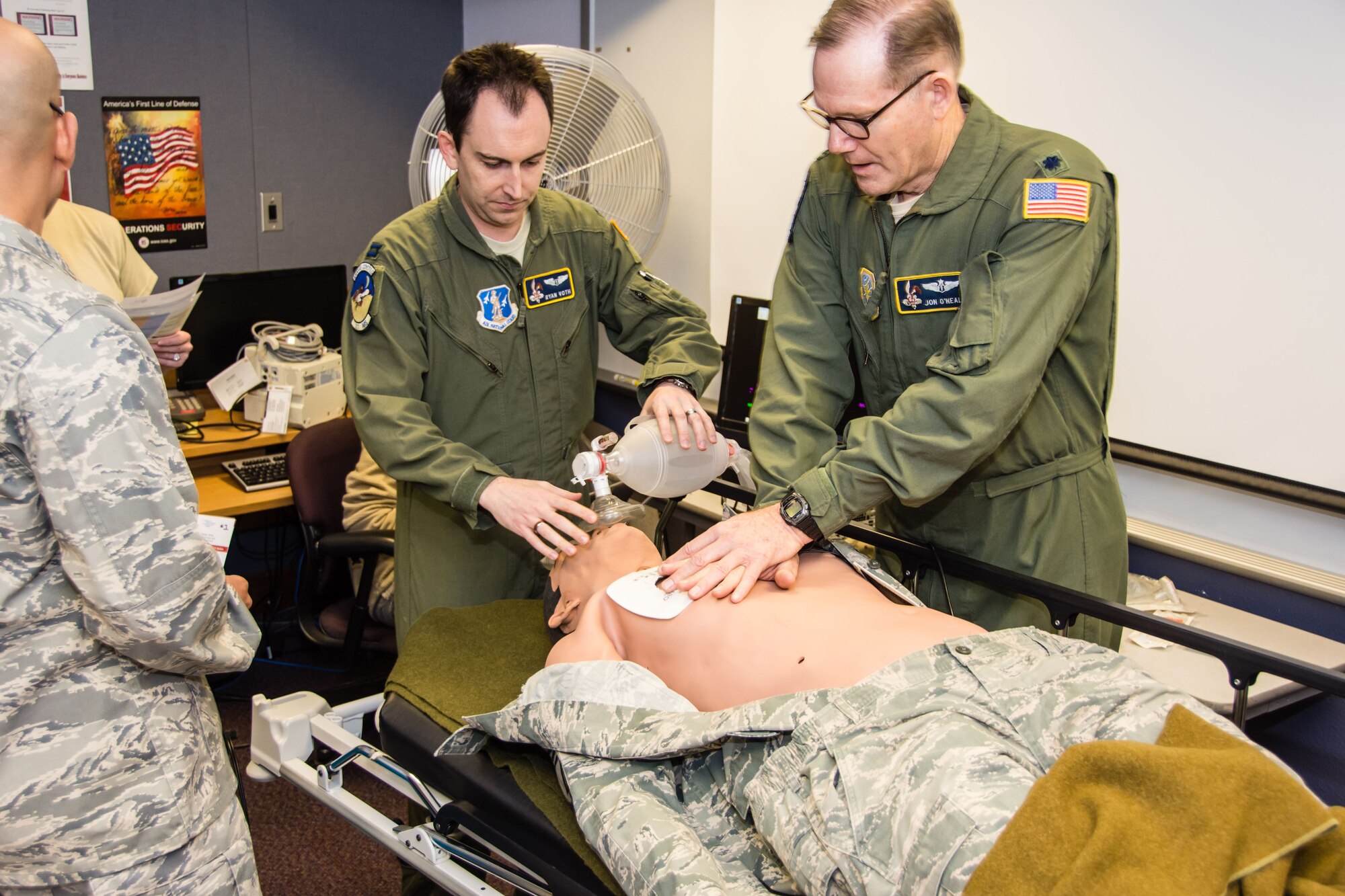 Capt. Ryan Voth and Lt. Col. Jon O’Neal, both members of the 190th Air Refueling Wing Medical Group, practice advanced cardiac life support during the Jan. drill. ALCS is basic life support with extra emphasis on cardiac support. Scenarios like this usually take place in a hospital setting. Training and equipment for these circumstances are not found in the  eld and require a higher echelon of care. (Photo by Staff Sgt. Kayla Kohn.)