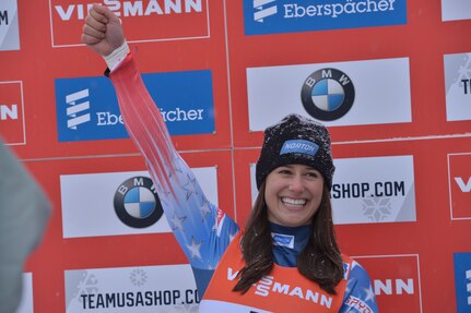 Sgt. Emily Sweeney waves to the crowd at the Lake Placid Olympic Center Dec. 16.