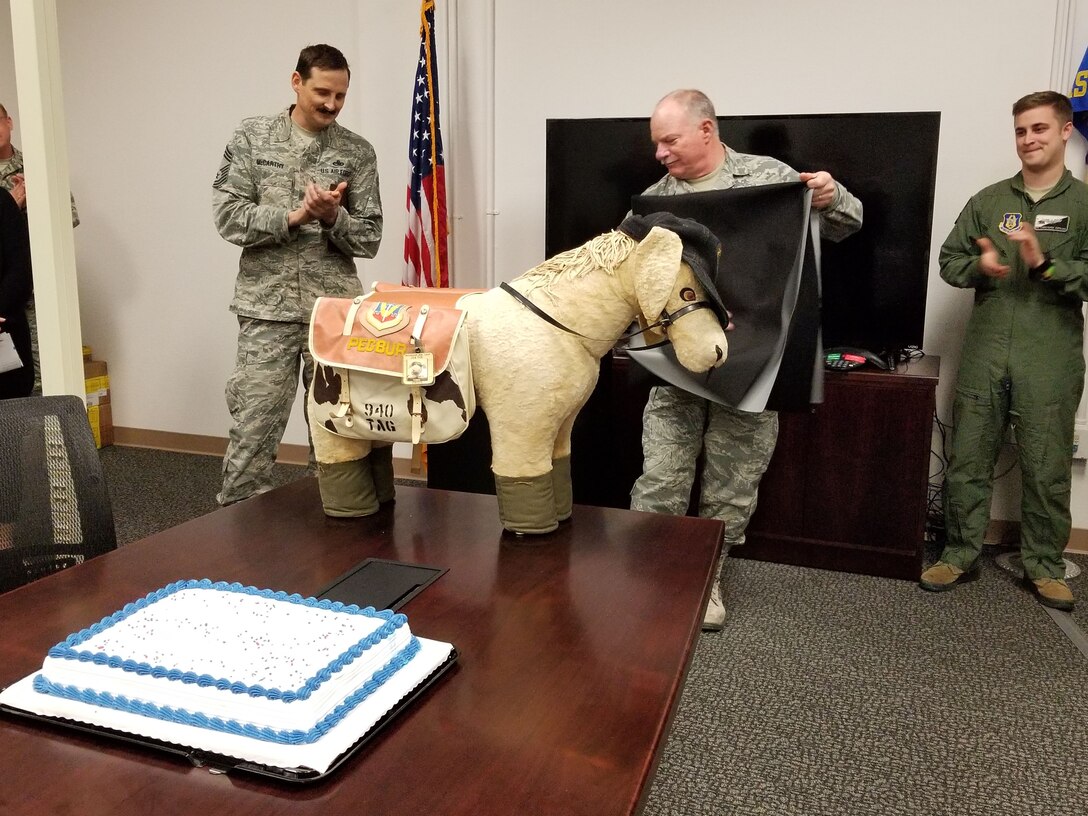 Chief Master Sgt. John Erwin unveils mascot