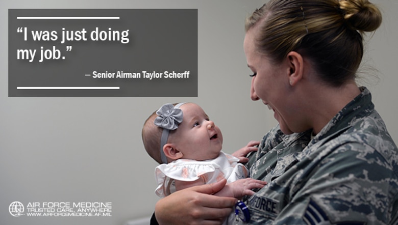 Senior Airman Taylor Scherff, 55th Medical Group Pediatric Clinic medical technician, tries to make three-month-old Isabelle Kittel smile in the Ehrling Bergquist Clinic at Offutt Air Force Base, Neb., Sept. 12, 2017. Scherff caught abnormalities in Kittle when she began taking her vital signs which led to the infant being taken to a catheterization laboratory and then into an emergency heart surgery. (U.S. Air Force photo by Tech. Sgt. Rachelle Blake)