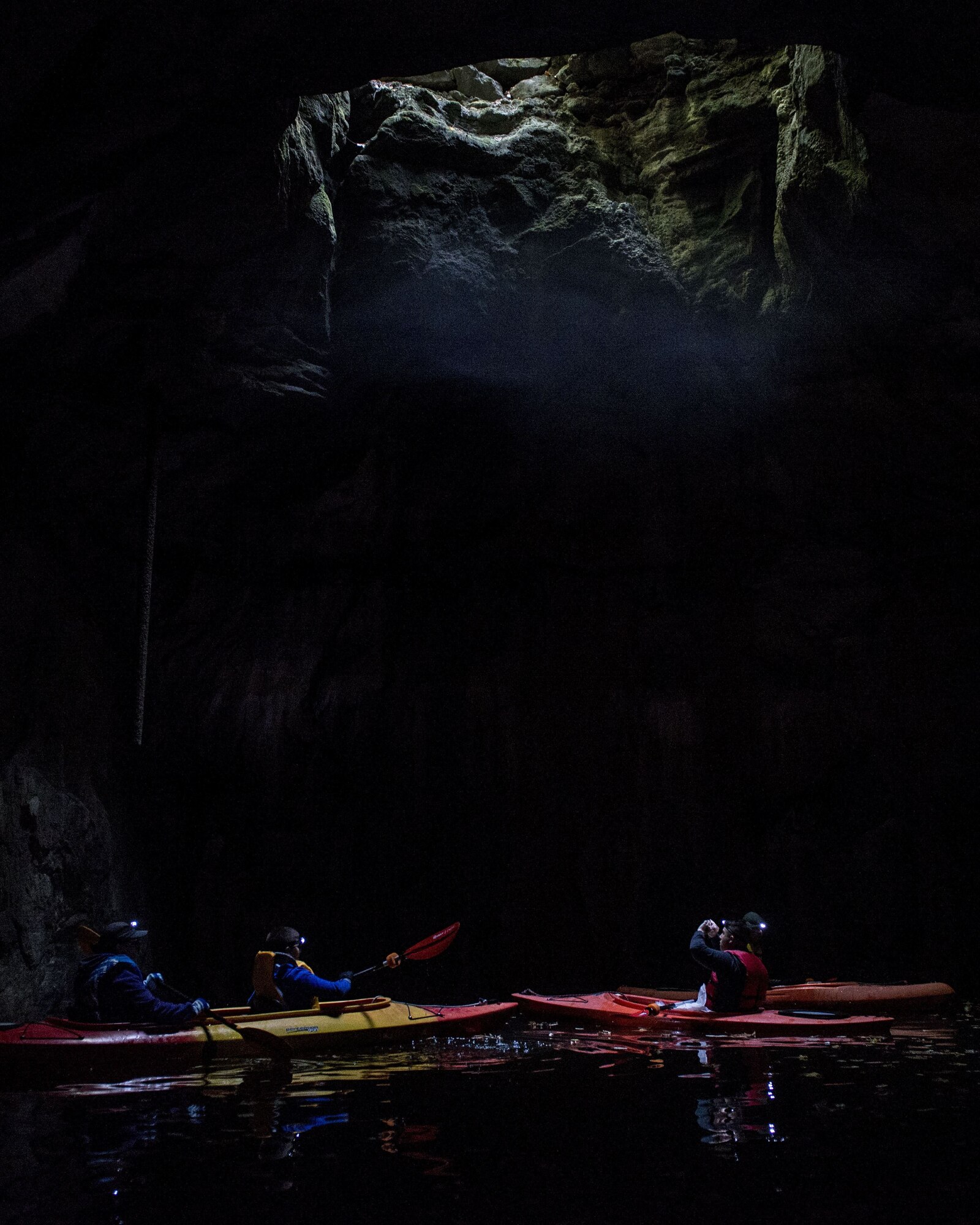 Kayakers with Scott Air Force Base Outdoor Recreation look up at an opening in a cavern, Sept. 23, 2017, at Crystal City Underground, an abandoned, submerged sandstone mine in Crystal City, Mo. The mine spans approximately 200 acres.  (U.S. Air Force photo by Airman 1st Class Tara Stetler)