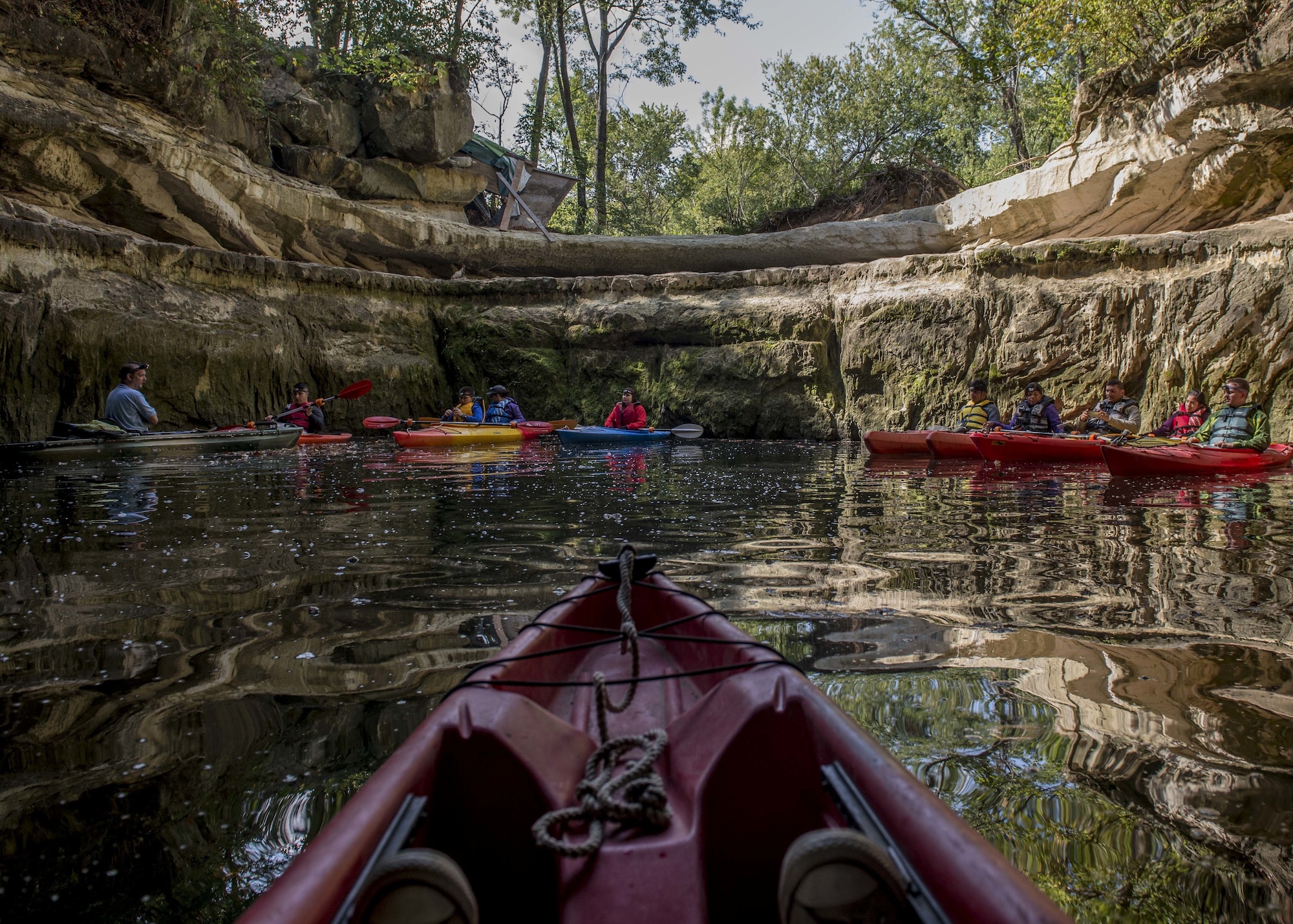 A group of with Scott Air Force Base Outdoor Recreation stops for a photo, Sept. 23, 2017, at Crystal City Underground, an abandoned, submerged sandstone mine in Crystal City, Mo. This opening is the only part of the tour where guests don’t need their headlamps. (U.S. Air Force photo by Airman 1st Class Tara Stetler)