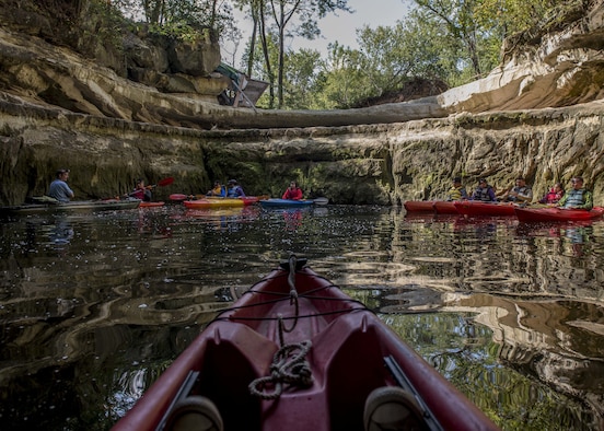 A group of with Scott Air Force Base Outdoor Recreation stops for a photo, Sept. 23, 2017, at Crystal City Underground, an abandoned, submerged sandstone mine in Crystal City, Mo. This opening is the only part of the tour where guests don’t need their headlamps. (U.S. Air Force photo by Airman 1st Class Tara Stetler)