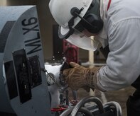 U.S. Air Force Airman 1st Class Jerry Timmons, 673d Logistics Readiness Squadron fuels facilities technician, chips ice from a 50-gallon liquid oxygen cart at Joint Base Elmendorf-Richardson, Alaska, Dec. 4, 2017. Oxygen is pressurized and cooled into a liquid state in order to transport it more efficiently from cryogenic tanks to JBER’s aircraft to provide fresh air to pilots in flight.