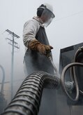 U.S. Air Force Airman 1st Class Jerry Timmons, 673d Logistics Readiness Squadron fuels facilities technician, observes a liquid level gauge on a 50-gallon liquid oxygen cart at Joint Base Elmendorf-Richardson, Alaska, Dec. 4, 2017. Oxygen is pressurized and cooled into a liquid state in order to transport it more efficiently from cryogenic tanks to JBER’s aircraft to provide fresh air to pilots in flight.