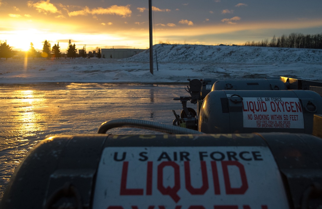 Filled liquid oxygen carts are ready for pick-up at the 673d Logistics Readiness Squadron fuels facilities section at Joint Base Elmendorf-Richardson, Alaska, Dec. 4, 2017. Oxygen is pressurized and cooled into a liquid state in order to transport it more efficiently from cryogenic tanks to JBER’s aircraft to provide fresh air to pilots in flight.