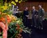 U.S. Air Force Capt. Joseph Manglitz, center, and Capt. Kyle Harrington, talk to Keith White, the florist of the Hall of Fame car for the 2018 Rose Parade, during a tour of the Decorating Places in Pasadena, Calif., Dec. 30, 2017. The car is one of only four cars that appear in the Rose Parade, and this year 2017 Rose Bowl Hall of Fame Inductees Mach Brown, Cade McNown, Charles Woodson and Dr. Charles West were honored with a ride down Colorado Boulevard in the car. (U.S. Air Force photo by Staff Sgt. Danielle Quilla)