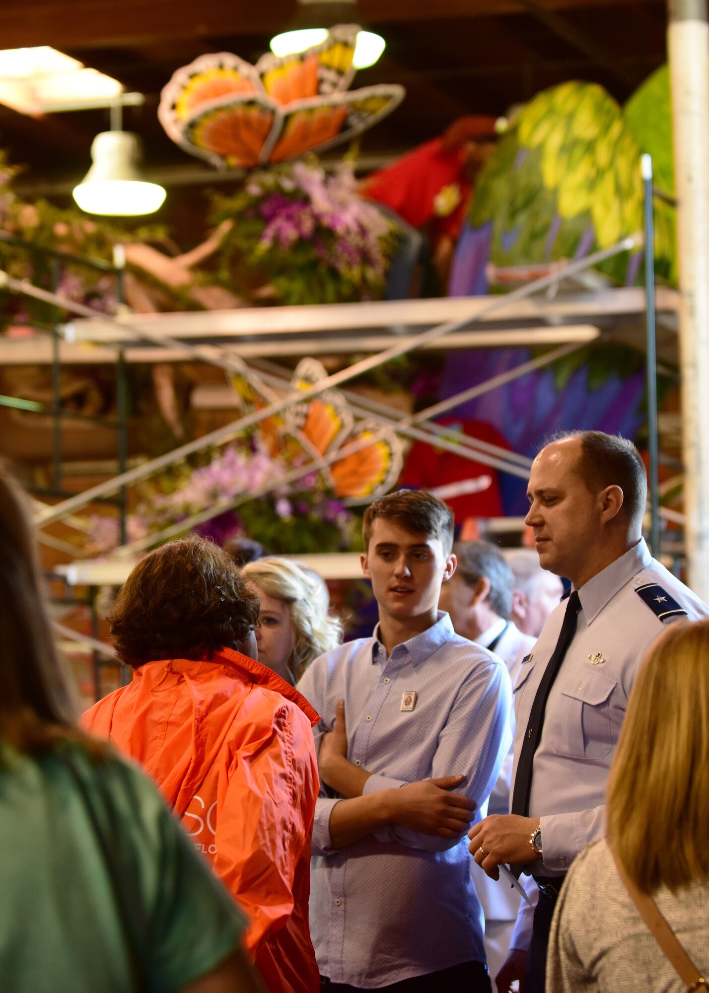 U.S. Air Force Brig. Gen. John Nichols, the 509th Bomb Wing commander, right, and his son Beau Nichols, speak to one of the float committee members during a tour of the Decorating Places as part of the 2018 Rose Parade events at Pasadena, Calif., Dec. 30, 2017. A total of 39 floats participated in the parade, along with many different marching bands and equestrian units. (U.S. Air Force photo by Staff Sgt. Danielle Quilla)