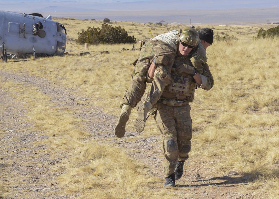 Students from the USAF Pararescue School load patients for aeromedical evacuation during a mass casualty exercise at Kirtland Air Force Base, N.M., Jan. 6. The exercise, part of a sequence of full mission profiles Pararescuemen and Combat Rescue Officer students must face before graduation, included more than 100 Airmen and Soldiers. Members of the 3-501st Air Assault Brigade from Fort Bliss, Texas, provided the air component with UH-60 Blackhawk helicopters.