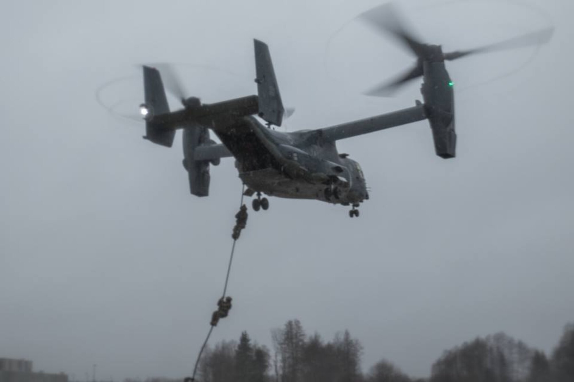 Estonian and U.S. Special Operation Forces operators prepare to board a U.S. Air Force CV-22 Osprey, assigned to the 352d Special Operations Wing, during fast rope training near Amari, Estonia, Dec. 12, 2017. Estonian and U.S. SOF conducted Fast Rope Insertion and Extraction System training to build combined NATO SOF readiness.