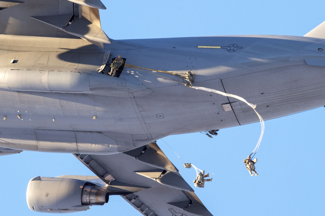 Soldiers jump from an Air Force C-17 Globemaster III during airborne training.