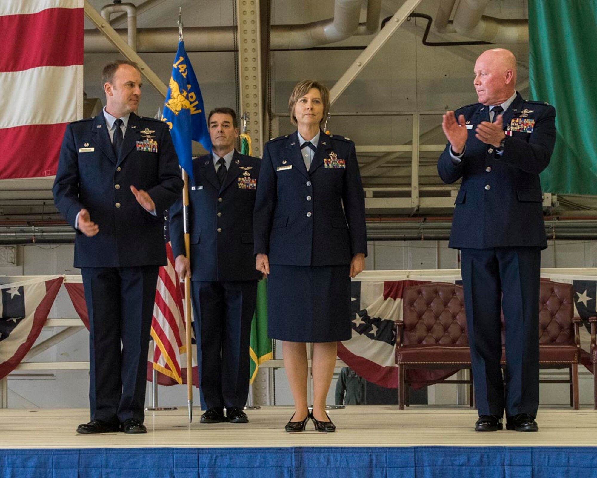 Lt. Col. Lisa McLeod (center), 141st Maintenance Group commander, assumed command of the 141st MXG from Col. David Dixon (right), during a change of command ceremony Jan. 6, 2018, at Fairchild Air Force Base, Washington. McLeod assumed command after serving as the 141st MXG deputy commander. Col. Johan Deutscher (left), 141st Air Refueling Wing commander, presided over the ceremony. (U.S. Air National Guard photo/Staff Sgt. Rose Lust)