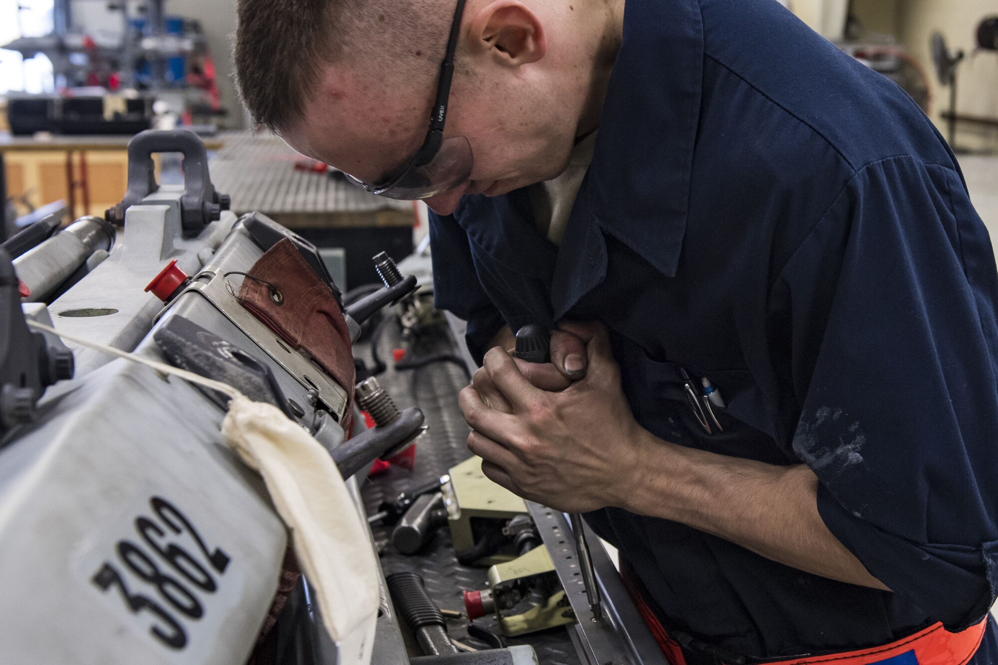 Airman 1st Class Joshua Mosel, 23d Maintenance Squadron armament journeyman, removes elements within a dual rail adapter, Jan. 9, 2018, at Moody Air Force Base, Ga. Moody’s armament flight is responsible for maintaining all of the aircraft weapons systems components when they're removed from the aircraft. This includes gun systems, alternate mission equipment and bomb racks. (U.S. Air Force photo by Senior Airman Janiqua P. Robinson)