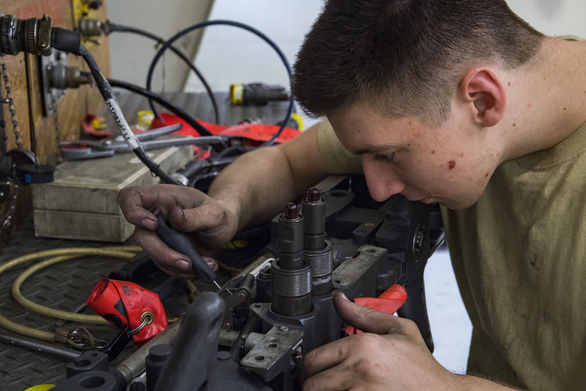Airman 1st Class Tanner Chilcote, 23d Maintenance Squadron armament journeyman, checks electrical components on a bomb rack, Jan. 10, 2018, at Moody Air Force Base, Ga. Moody’s armament flight is responsible for maintaining all of the aircraft weapons systems components when they're removed from the aircraft. This includes gun systems, alternate mission equipment and bomb racks. (U.S. Air Force photo by Senior Airman Janiqua P. Robinson)