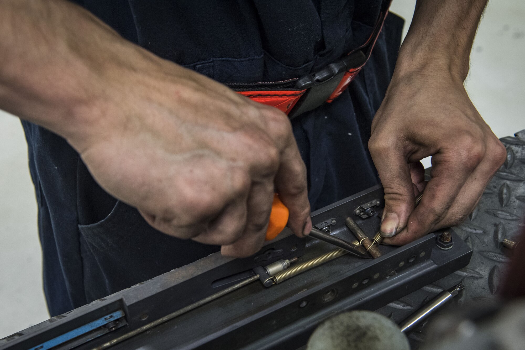 Airman 1st Class Joshua Mosel, 23d Maintenance Squadron armament journeyman, removes elements within a dual rail adapter, Jan. 9, 2018, at Moody Air Force Base, Ga. Moody’s armament flight is responsible for maintaining all of the aircraft weapons systems components when they're removed from the aircraft. This includes gun systems, alternate mission equipment and bomb racks. (U.S. Air Force photo by Senior Airman Janiqua P. Robinson)
