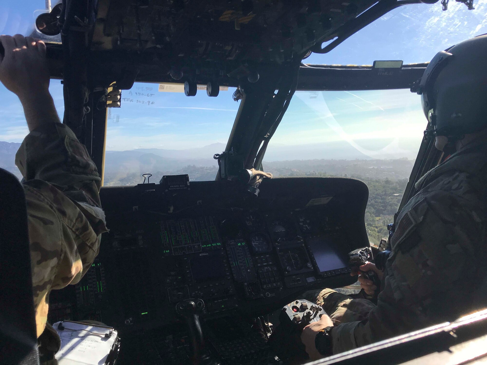 A California Air National Guard HH-60G Pave Hawk rescue helicopter with air crews and  two elite Guardian Angel pararescuemen from the 129th Rescue Wing Moffett Air National Guard Base, Calif, provide search and rescue operations in Southern California, impacted by a mud slides, Jan. 10, 2018. (Courtesy photo by Staff Sgt. Cristian Meyers/released)