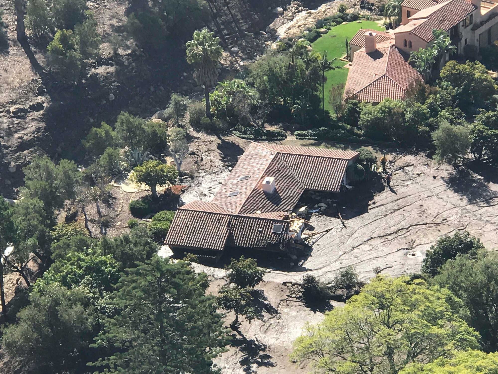 A California Air National Guard HH-60G Pave Hawk rescue helicopter with air crews and  two elite Guardian Angel pararescuemen from the 129th Rescue Wing Moffett Air National Guard Base, Calif, provide search and rescue operations in Southern California, impacted by a mud slides, Jan. 10, 2018. (Courtesy photo by Staff Sgt. Cristian Meyers/released)