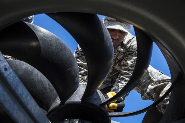 Staff Sgt. Zachary Pigg, 23d Civil Engineer Squadron Heating, Ventilation and Air Conditioning (HVAC) journeyman, ensured a fan is placed correctly, Jan. 10, 2018, at Moody Air Force Base, Ga. The equipment that keeps Moody comfortable indoors is designed for a climate that is typically warm year round, but when temperatures fall below 40 degrees, the equipment starts to malfunction. With temperatures recently dipping into the low teens and snow falling this winter for the first time since 2010, Airmen who work in Moody’s HVAC flight credit the weather for the busy winter they’re having. (U.S. Air Force photo by Senior Airman Janiqua P. Robinson)