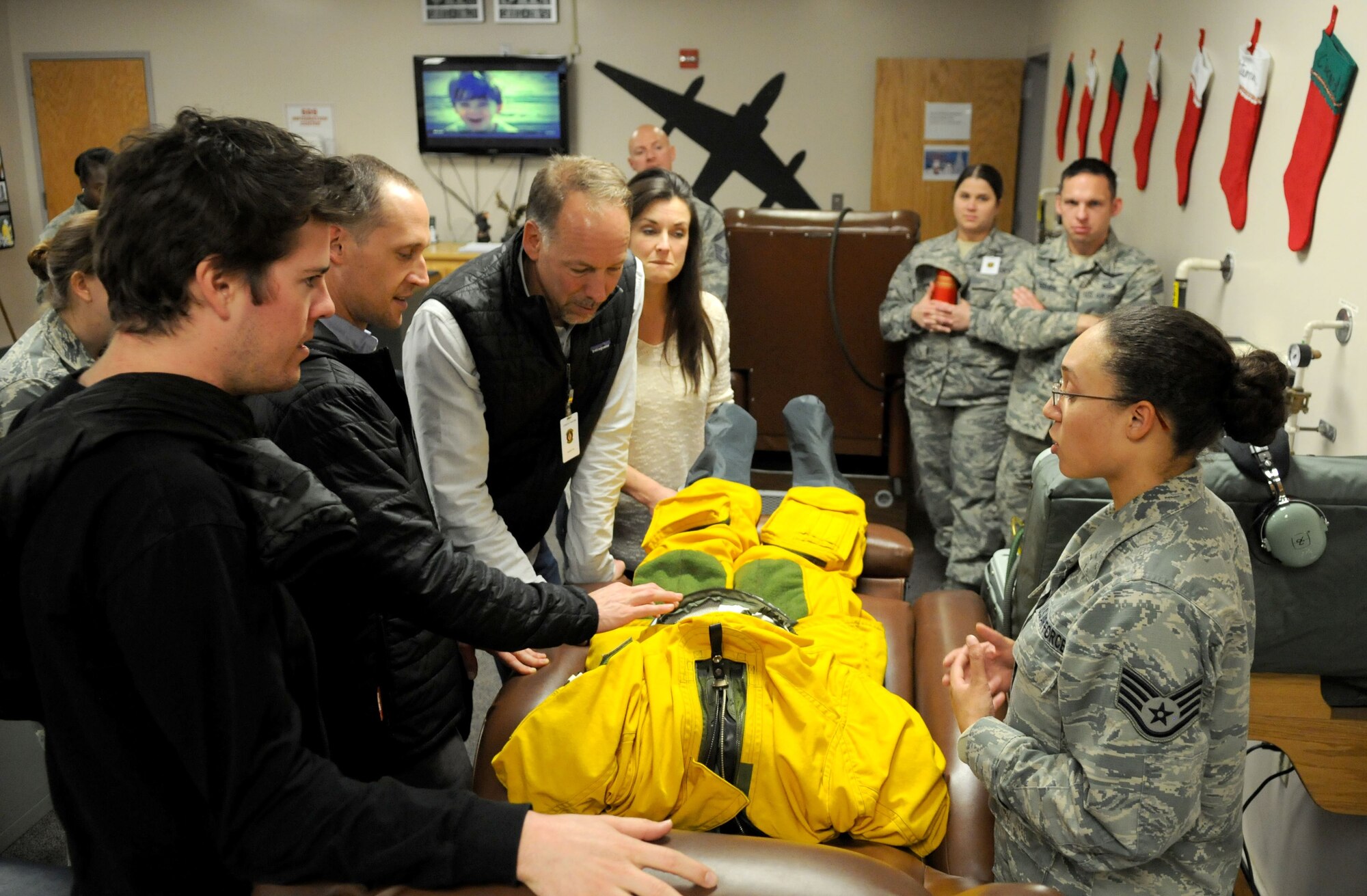 Members of Stanford University Design School learn about the U-2 Dragon Lady pilot suit as part of their visit for a design thinking seminar on the Inaugural Design Day