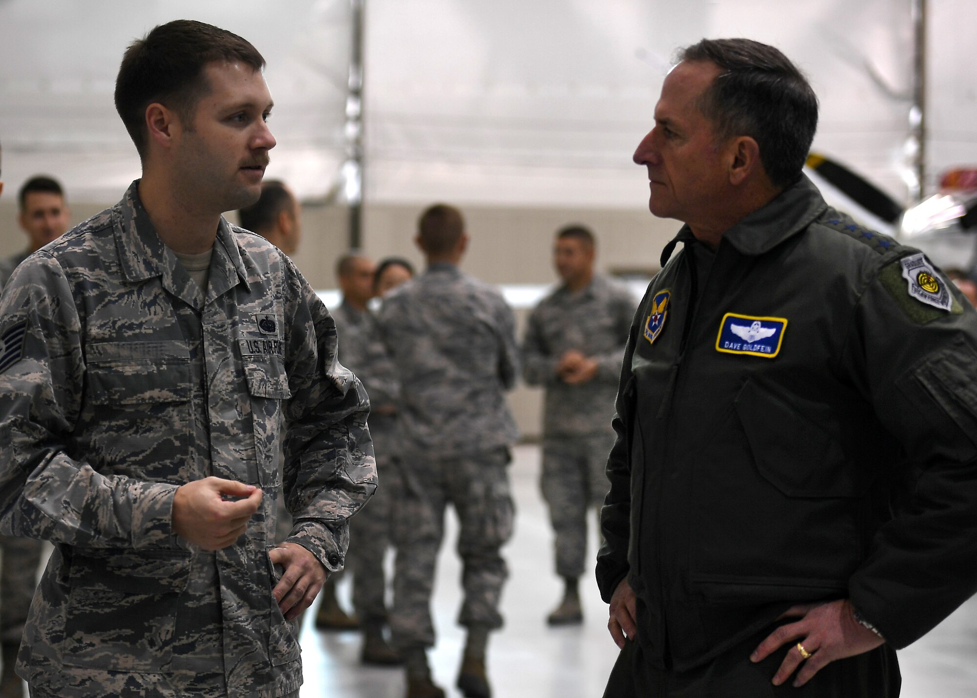 Air Force Chief of Staff Gen. David L. Goldfein speaks to Tech. Sgt. Stephen, 432nd Aircraft Communications Maintenance Squadron, mission defense team lead, about a new Remotely Piloted Aircraft initiative during his visit to Creech Air Force Base, Nev., Jan. 9, 2018. Goldfein visited the Airmen of the 432nd Wing/432nd Air Expeditionary Wing to view RPA operations firsthand and to discuss the future of the enterprise. (U.S. Air Force photo/Master Sgt. Nadine Barclay)