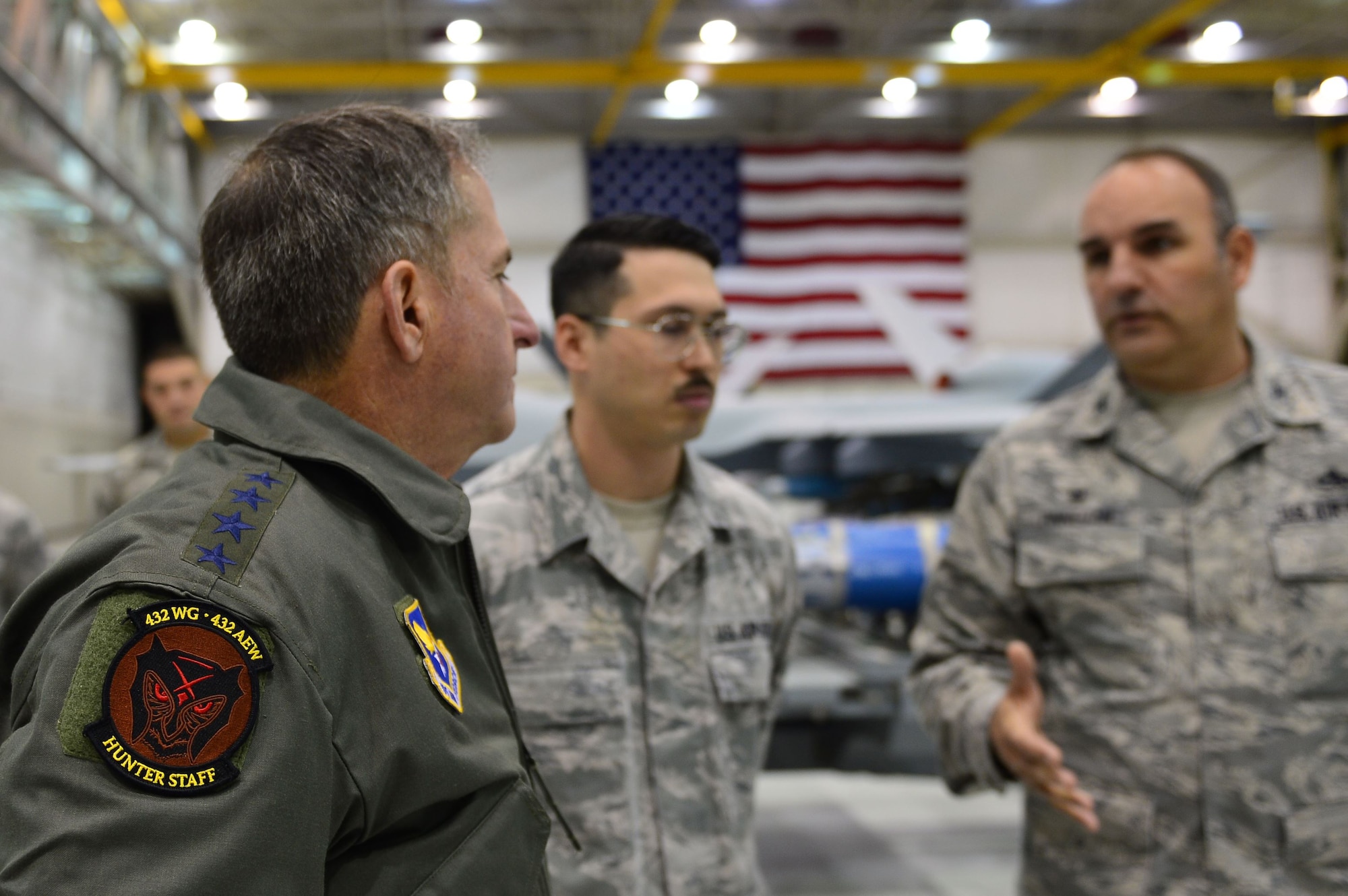 Air Force Chief of Staff Gen. David L. Goldfein speaks to Col. Matthew, 432nd Maintenance Group commander, Jan. 9, 2017, at Creech Air Force Base, Nev. Goldfein visited with the 432nd Wing/432nd Air Expeditionary Wing and 799th Air Base Group Airmen who deliver persistent attack and reconnaissance 24/7/365 against the nation’s enemies.  (U.S. Air Force photo/Airman 1st Class Haley Stevens)
