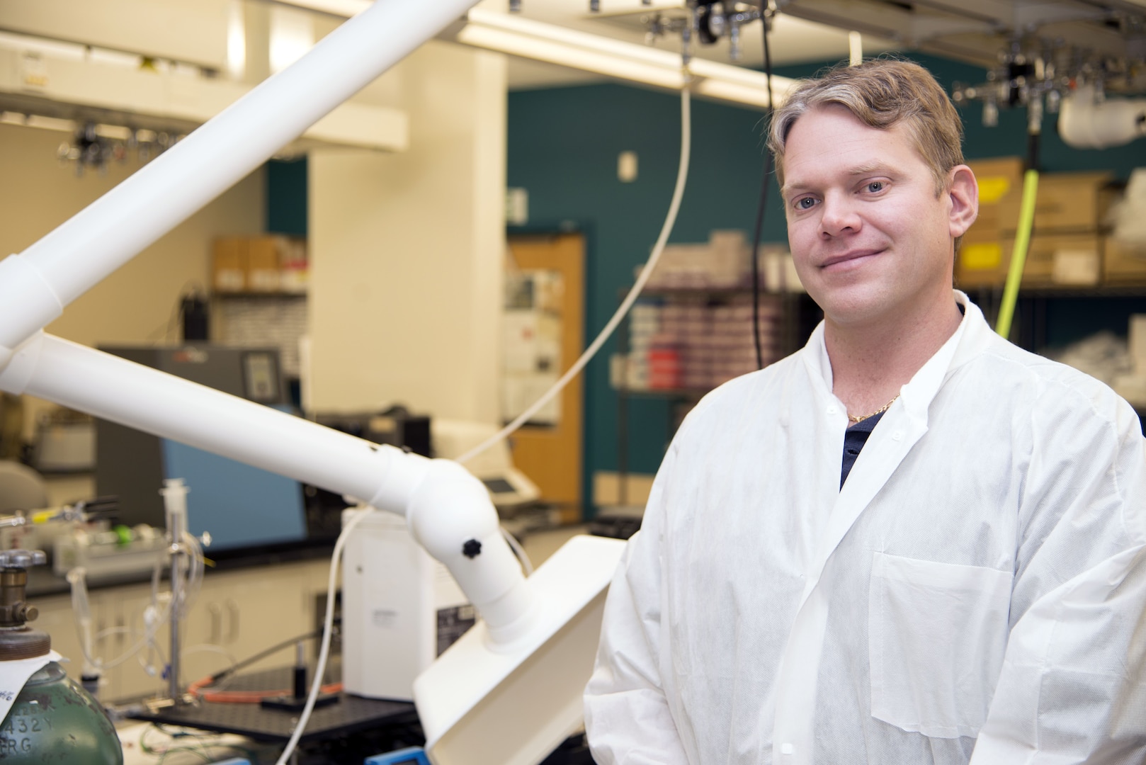 Dr. Alexander Burdette, Naval Medical Research Unit San Antonio principal investigator, sits by a computer display in his office at Joint Base San Antonio-Fort Sam Houston showing a process for bone regeneration. Burdette is involved in a research project to find if the use of biological therapeutics can provide a better method for bone regeneration that could improve treatment for service members and patients whose bone tissue has been damaged by a traumatic injury.