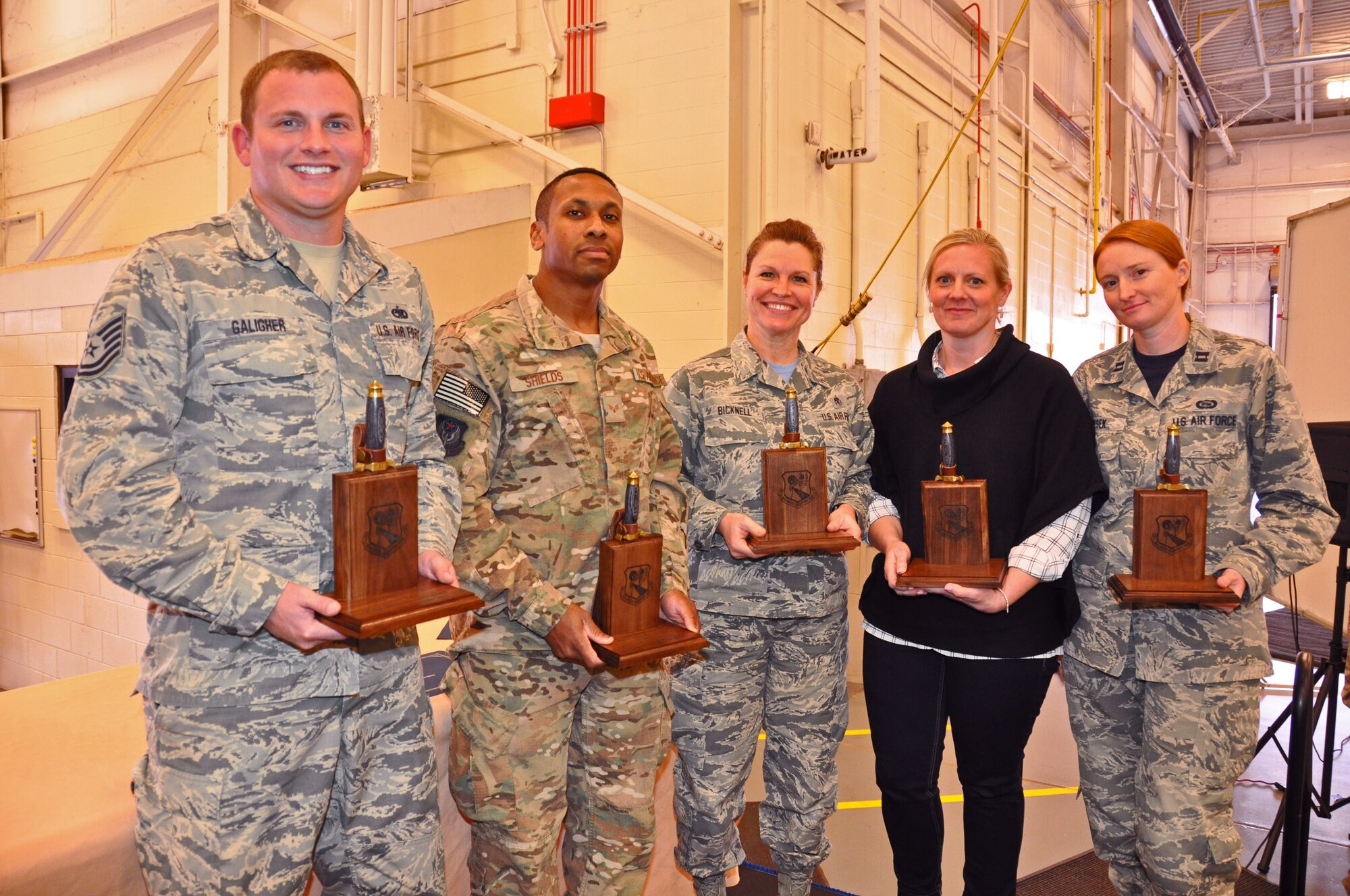 The 919th Special Operations Wing’s annual award winners for the period October 2016 to September 2017 display their trophies during a ceremony