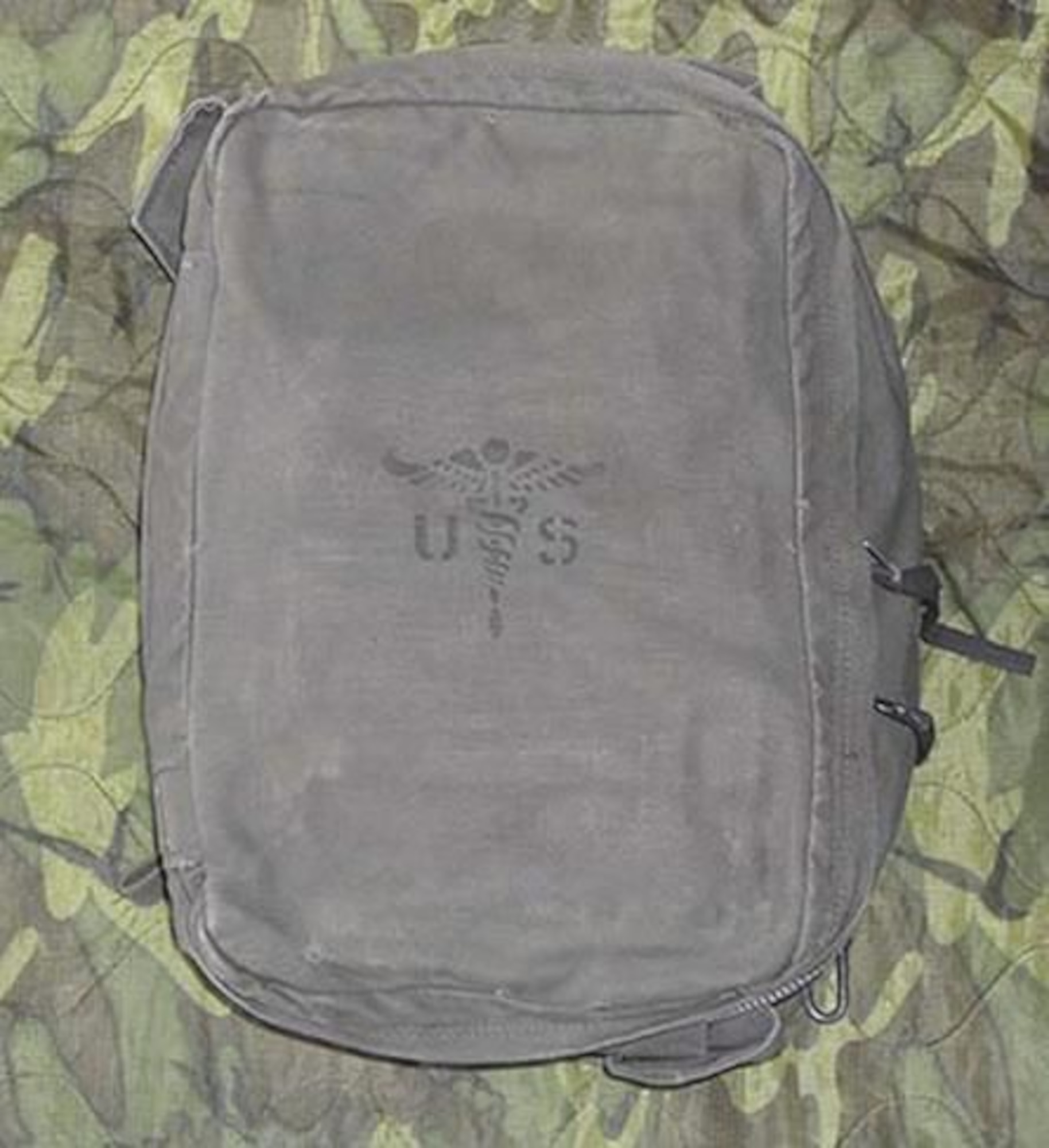 This rectangular canvas rucksack contains large internal space for storing various assorted medical equipment. It has several inner pockets and ties to keep an M5 aid bag secure. The M5 bag contained all the medical supplies a platoon would need. (Photo courtesy of Army Medical Department Center of History and Heritage, U.S. Army Medical Command)