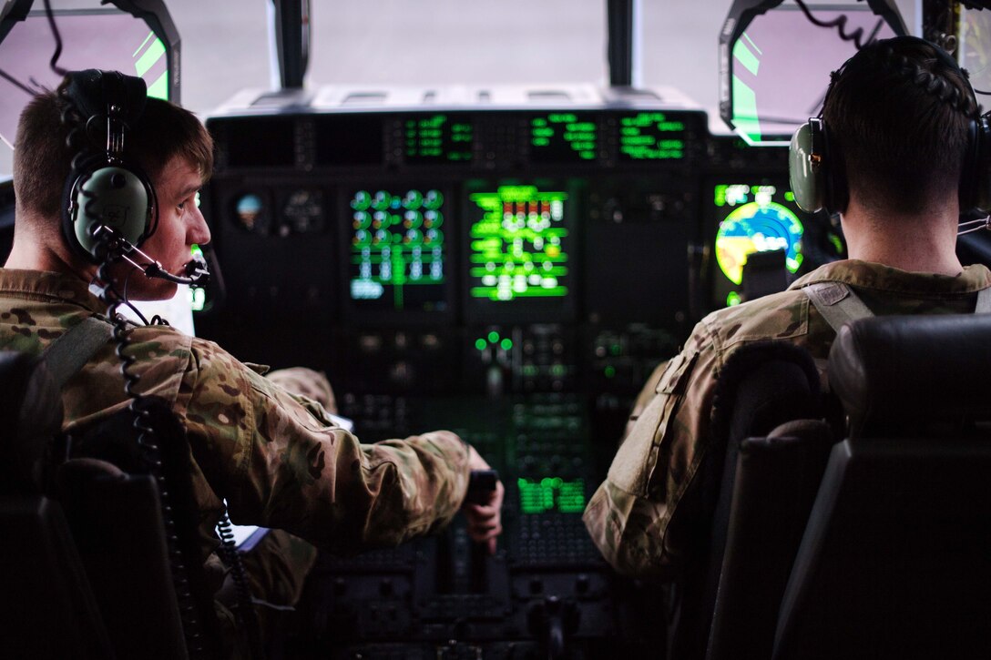 Air Force pilots prepare to take off in their C-130J Super Hercules.