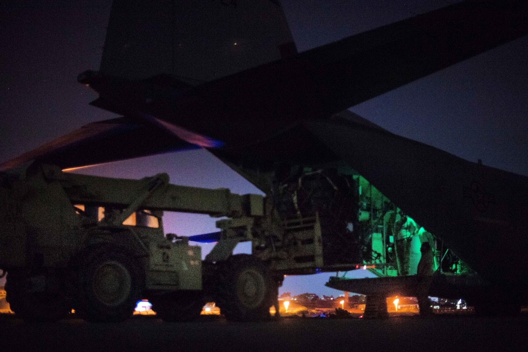 Airmen load cargo onto a C-130J Super Hercules before conducting operations.