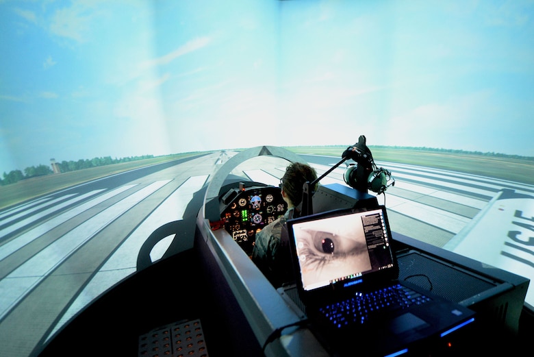 Second Lt. Madeline Schmitz, 14th Student Squadron student pilot, prepares to take flight in the T-6 Texan II flight simulator Jan 10, 2018, on Columbus Air Force Base, Mississippi. The Adaptive Flight Training Study here pushed subjects to learn through the virtual reality technology but used the T-6 flight simulator as a baseline to compare the other VR sorties to. This allowed researchers to see if the subject’s flights got better or worse after the VR flight training. (U.S. Air Force photo by Airman 1st Class Keith Holcomb)