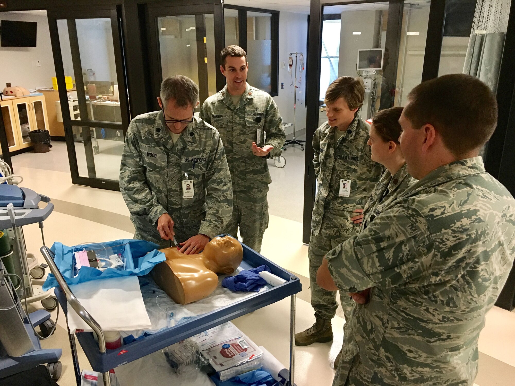 Students participate in a central line task training on a simulated patient. Simulated medical training allows medical professionals to practice and improve their skills with no physical risks to patients. (U.S. Air Force Photo/Johnny Cartwright)