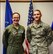 Col. Stacy Jo Huser, 90th Missile Wing commander, and Airman Anthony Taylor, 90th Logistics Readiness Squadron fleet manager analyst, pose for a photo at F.E. Warren Air Force Base, Wyo., Jan. 10, 2018. Taylor participated in the day with the commanders program, allowing him to shadow the commander to learn about the wings operations. (U.S. Air Force photo by Airman 1st Class Braydon Williams)