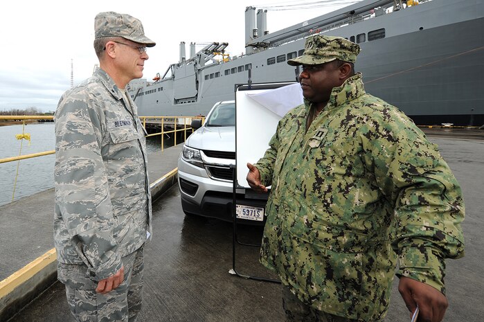 Navy Lt. Brandley Sinoc, right, Port Operations officer, briefs U.S. Air Force Brig. Gen. Steven J. Bleymaier, director of logistics, engineering and force protection, Headquarters Air Mobility Command, Scott Air Force Base, Ill on how seaport infrastructure impacts operations and other tenant commands on Joint Base Charleston - Weapons Station, Jan. 10, 2018. Bleymaier visited JB Charleston to get a better understanding of joint operational capabilities and to meet with services members.