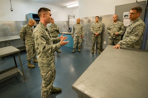 U.S. Air Force 2nd Lt. Robert “Bo” Huebel, left, 437th Aircraft Maintenance Squadron sortie support flight commander, briefs Brig. Gen. Steven J. Bleymaier, director of logistics, engineering and force protection, Headquarters Air Mobility Command, Scott Air Force Base, Ill at Joint Base Charleston. Jan. 10, 2018.