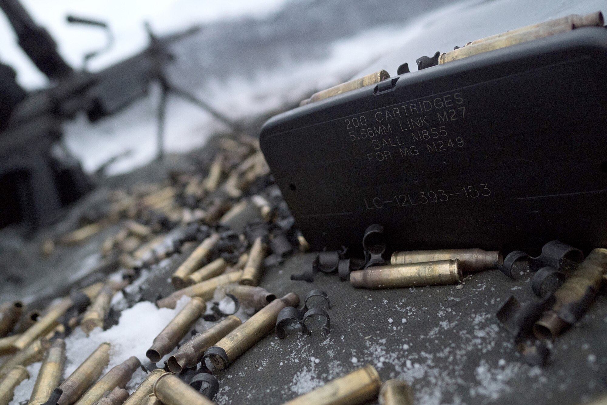 Expended 5.56mm casings cover the ground as Airmen assigned to the 673d Security Forces Squadron conduct an M249 Squad Automatic Weapon, and M2 .50 Caliber machine gun qualification range on Joint Base Elmendorf-Richardson, Alaska, Jan. 10, 2018. Security Forces Airmen perform extensive training in law enforcement as well as combat tactics to protect U.S. Military bases and assets both stateside and overseas.