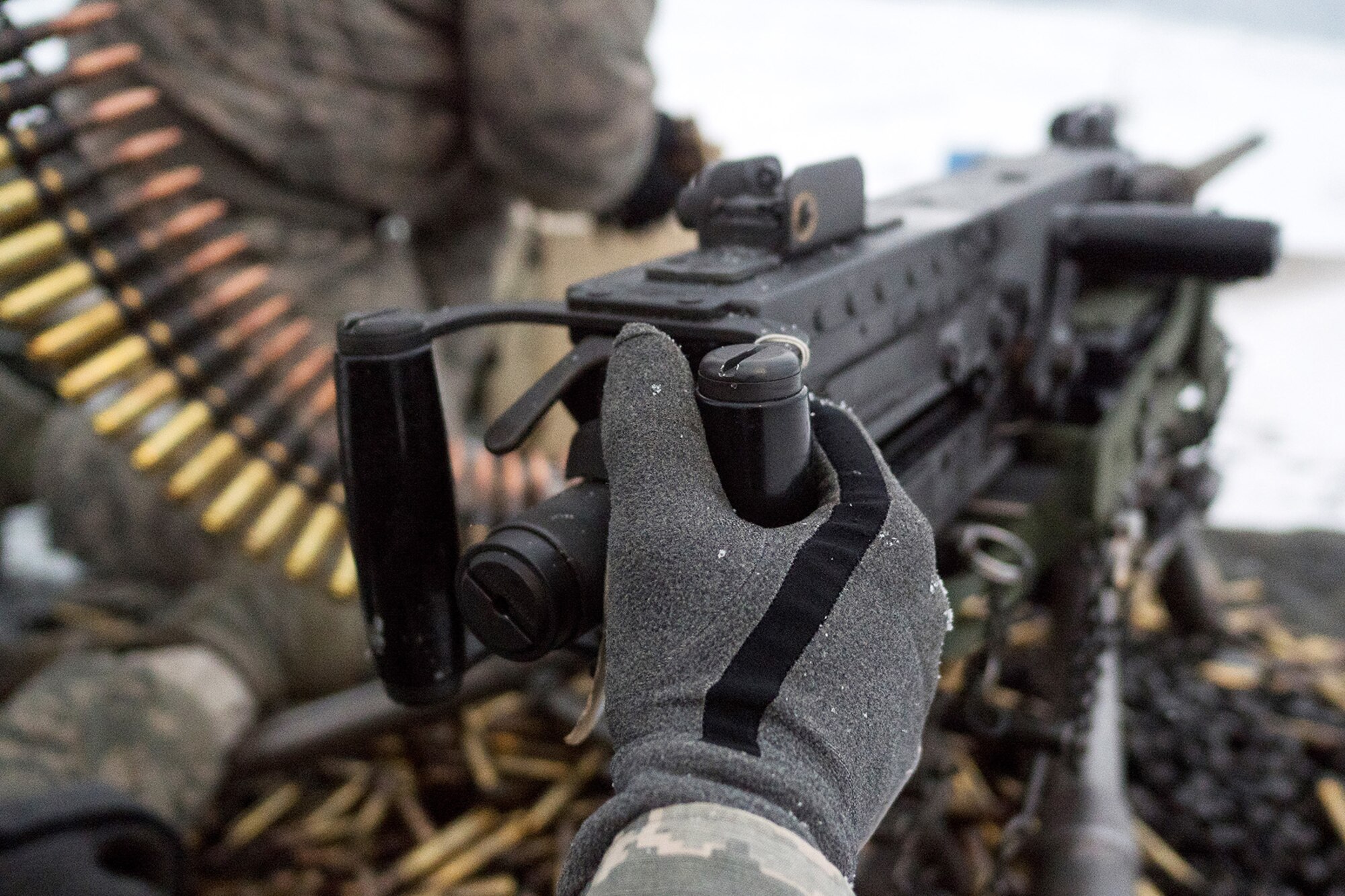 Airmen assigned to the 673d Security Forces Squadron load an M2 .50 Caliber machine gun during a qualification range on Joint Base Elmendorf-Richardson, Alaska, Jan. 10, 2018. Security Forces Airmen perform extensive training in law enforcement as well as combat tactics to protect U.S. Military bases and assets both stateside and overseas.